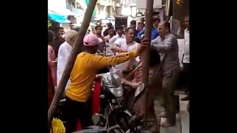 A video went viral showing a man hitting & pushing a woman in Kamathipura, Mumbai