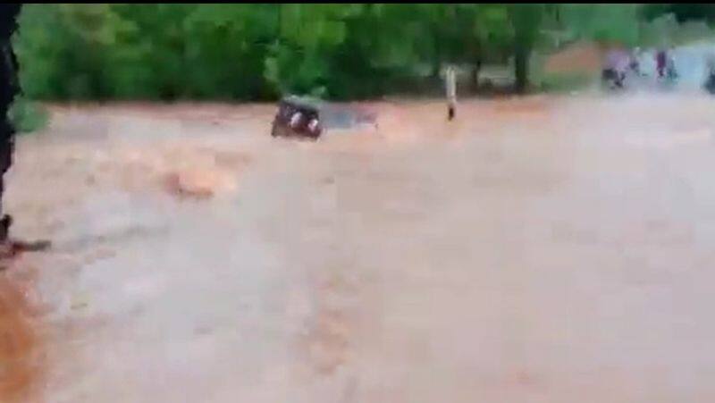 Rescued 6 people trapped in a car washed away by flood at vedachandur