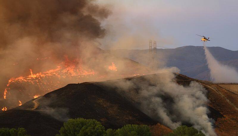 California wildfire burns homes, force towns to flee: Report AJR