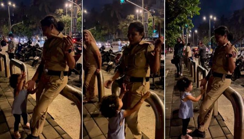 Child begging for police lathi  to a woman cop a cute video 