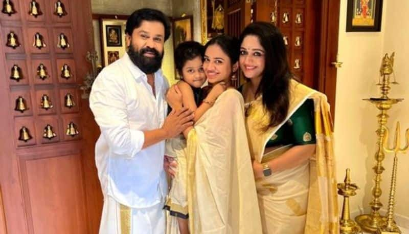 actor dileep onam wishes  share family photos with kavya madhavan