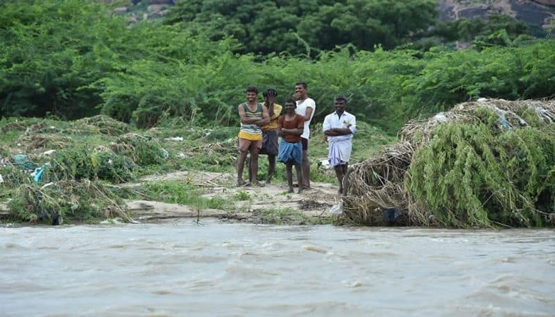 Police And fire-brigade team recuses Five Farmers Who stuck in flood at Koppal rbj