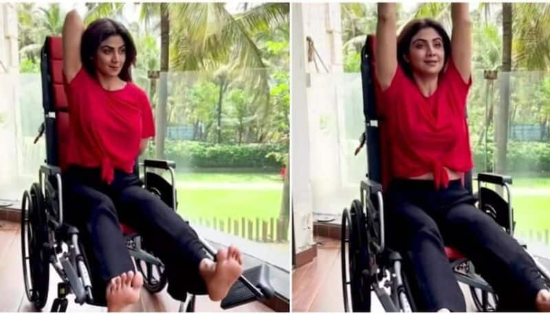 Shilpa Shetty performs yoga asanas with an injured leg on a wheelchair