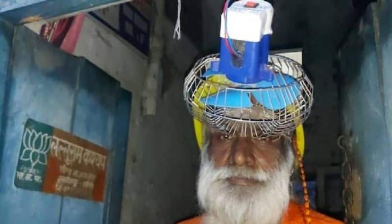 man wear helmet with fan 