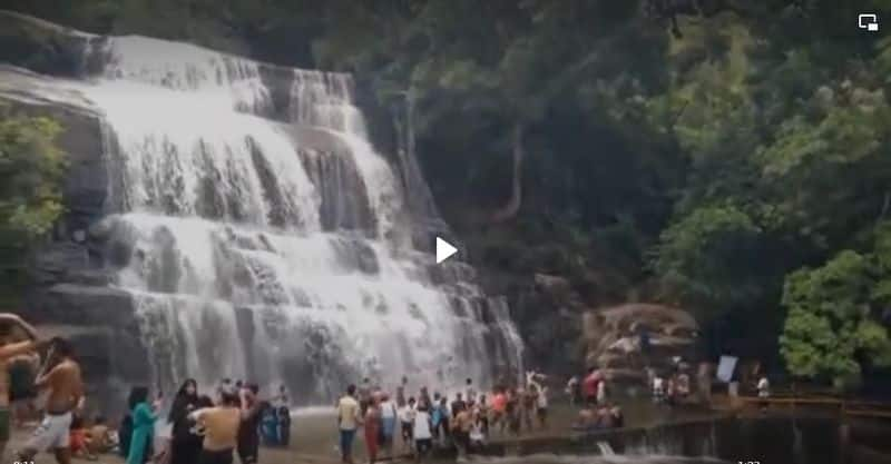 Tourists gathered at Suruli  waterfall in Theni district