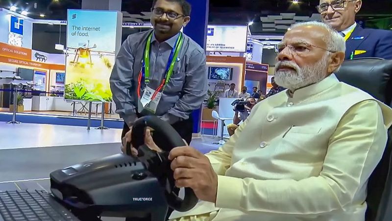 using 5g link  pm modi drives car in sweden from delhi watch video ash 