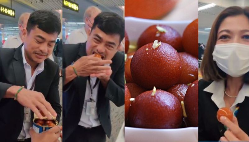 youth offers gulab jamuns to security officers in Phuket airport as they stopped him from carrying it