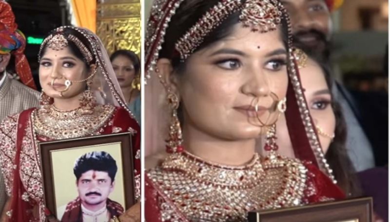 Bride enters mandap with grandfather while holding late fathers portrait