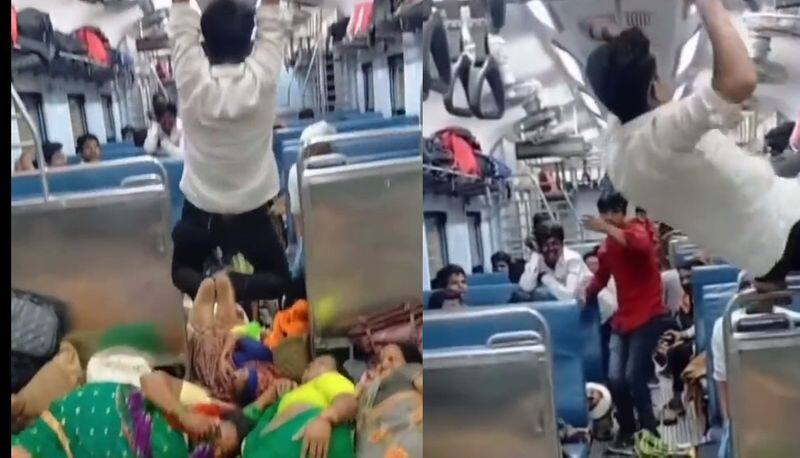 man hanging like spider man video goes viral which captured inside Mumbai local train man hanging like spider man akb