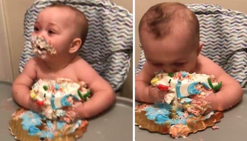 funny video in which toddler eating birthday cake 