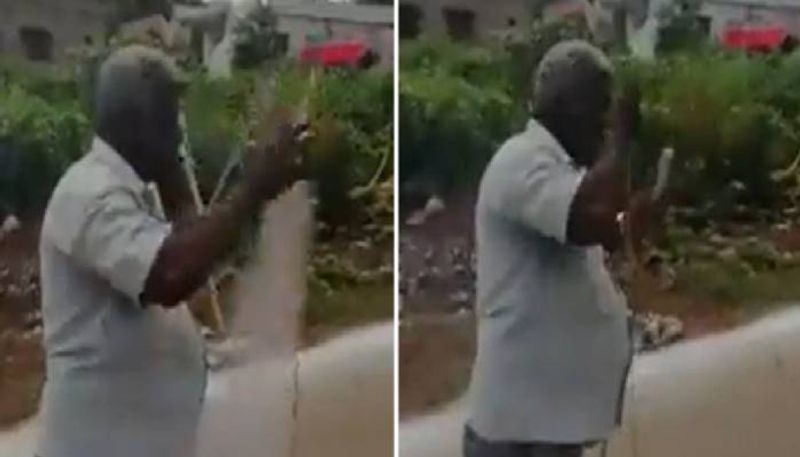 man lights firecrackers from cigarette 