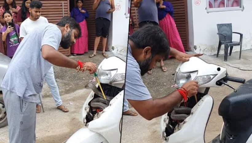 Man rescues cobra stuck inside scooter with bare hands; watch video