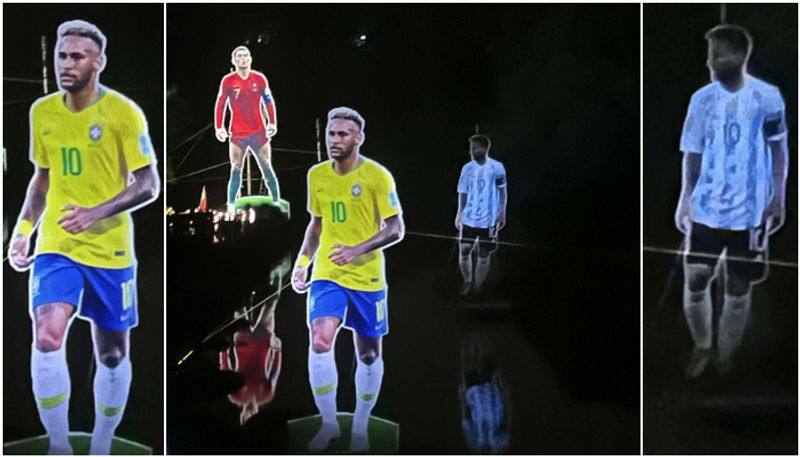 football fans raise cristiano ronaldo cut out near messi and neymar