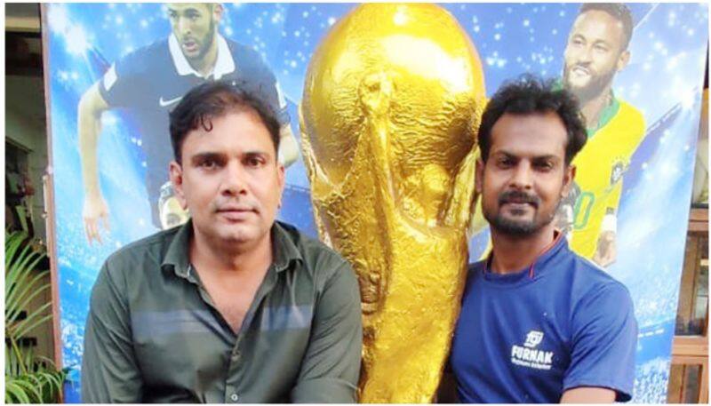 Youths finish a giant World Cup model in gypsum