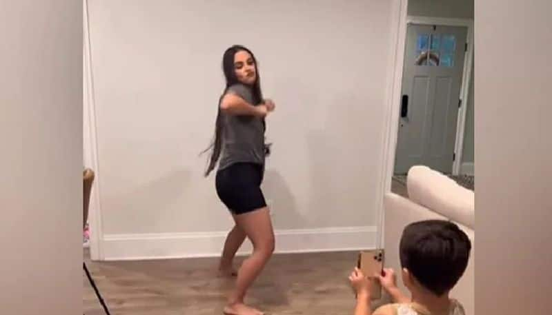 mother records cute babys expressions while she is dancing 