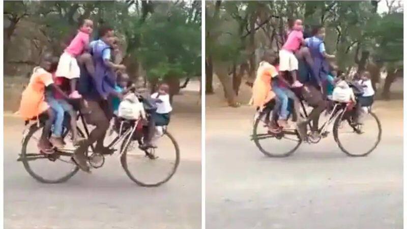 Man rides bicycle with 9 children in bizarre viral video. Internet reacts