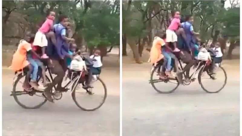 Man rides bicycle with 9 children in bizarre viral video. Internet reacts