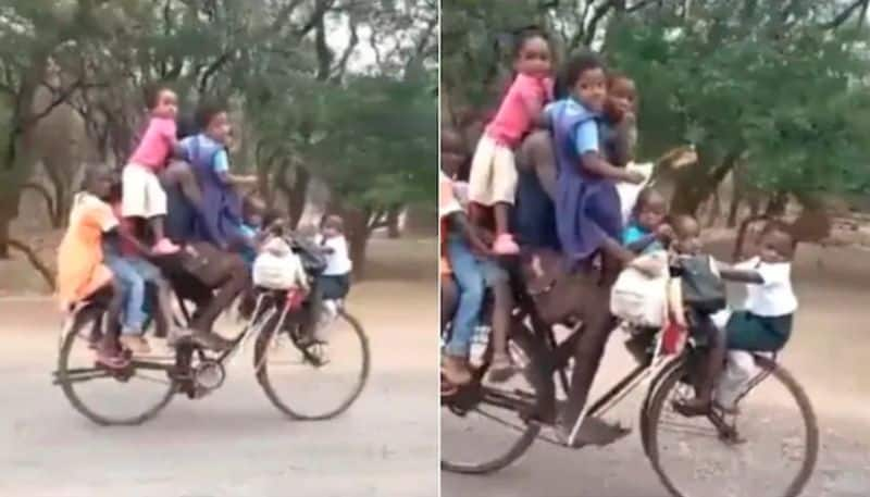 Man rides bicycle with 9 children in bizarre viral video