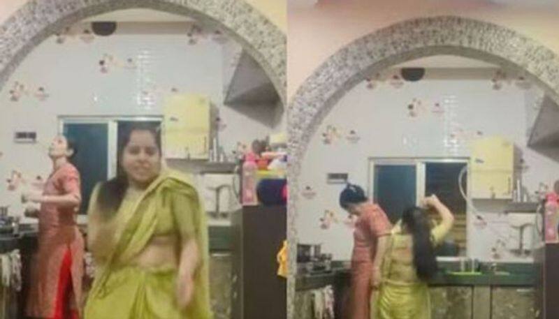 Woman dances enthusiastically in front of her mother in law