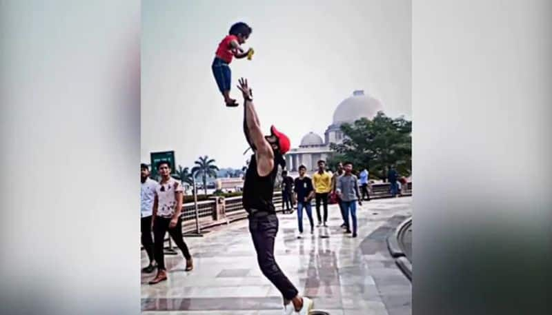 mans stunt with kid goes viral in social media 