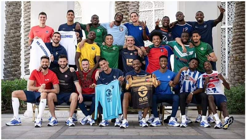 France team pose for a squad picture wearing jerseys of their first amateur club