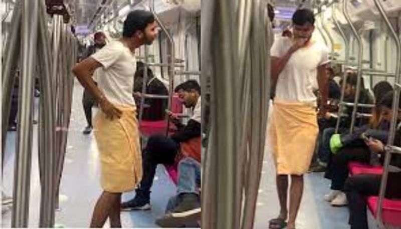 Man boards Delhi metro wearing a towel