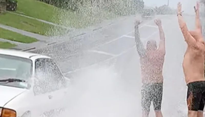 Video Of Men Waiting For Cars To Splash Water On Them Goes Viral