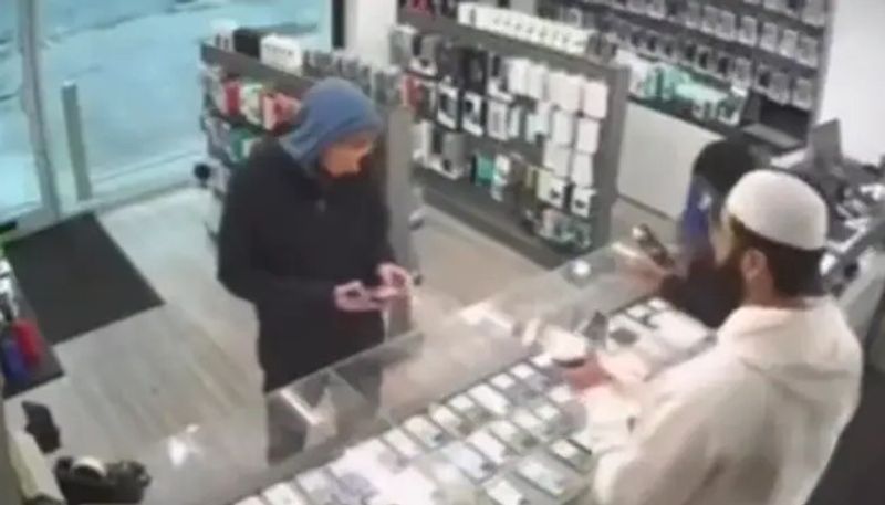 thief trying to run away with mobile phone from a shop but caught 