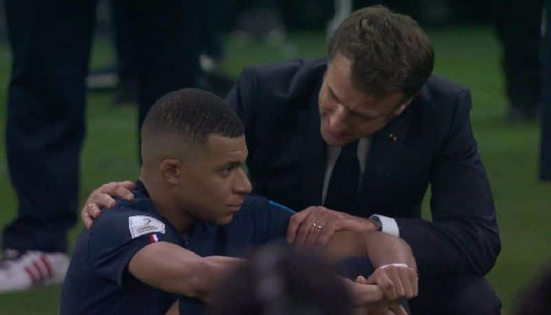 Picture of French President Emmanuel Macron on haunches consoling Mbappe after Fifa loss is winning hearts kvn