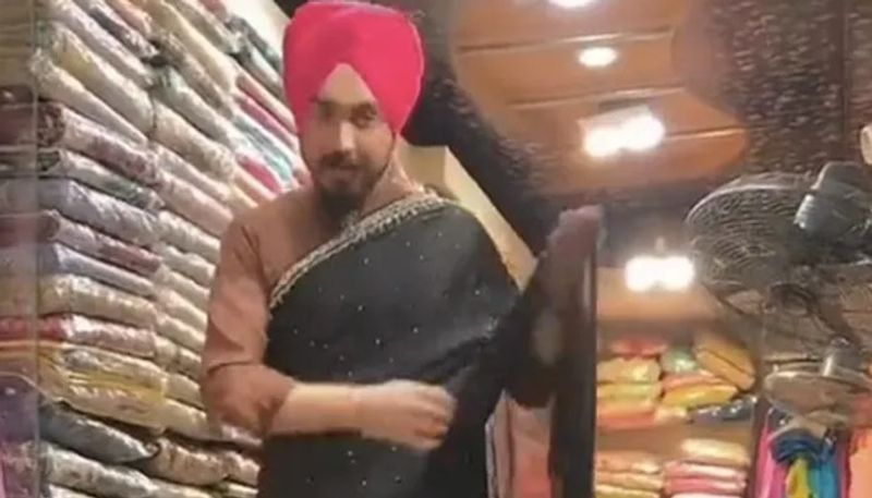 man drapes saree easily at a store the video goes viral 