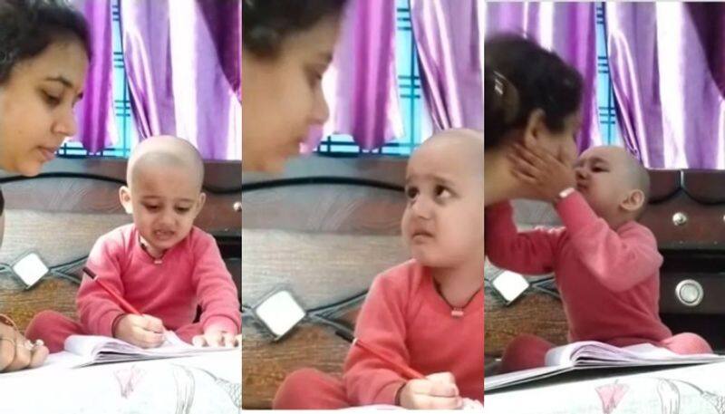 Toddler cries while studying with his mother