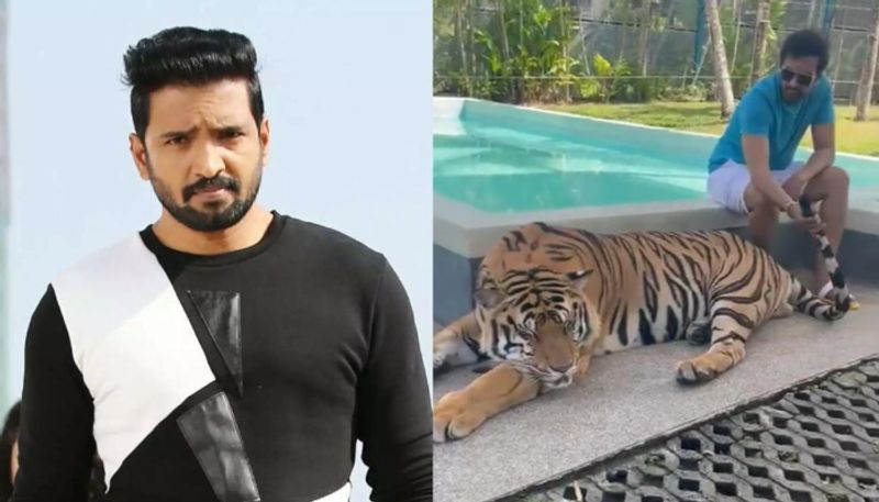 Santhanam pets a tiger in viral video Netizens slam him