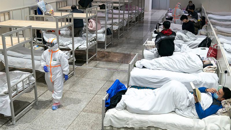 china covid deaths hit 9000 per day says report as more nations impose travel restrictions