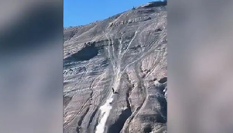 mans adventurous bike ride on steep rocks goes viral 