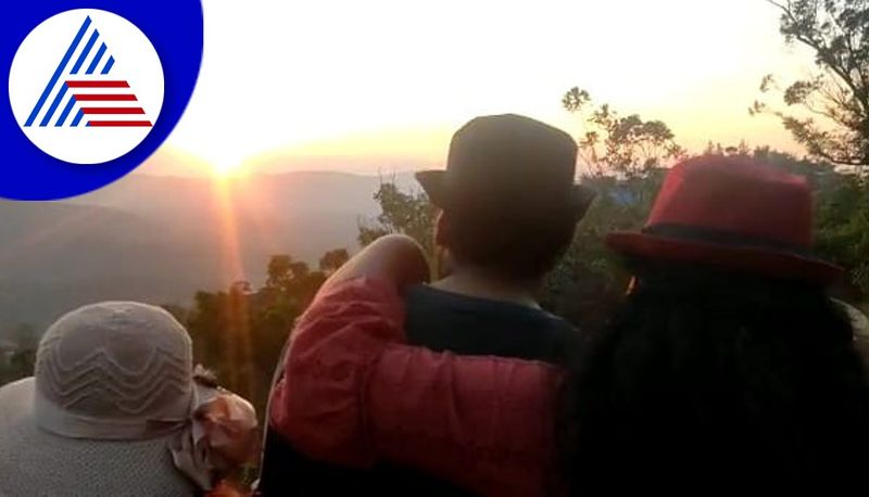 Tourists watching the last sunset of the year at kodagu gvd