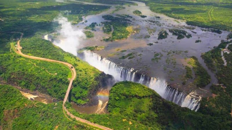 Woman Leans 360 feet tall Victoria Falls in breathtaking viral video