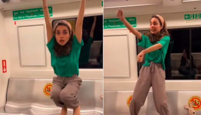 Woman swings on handrails and dances in metro