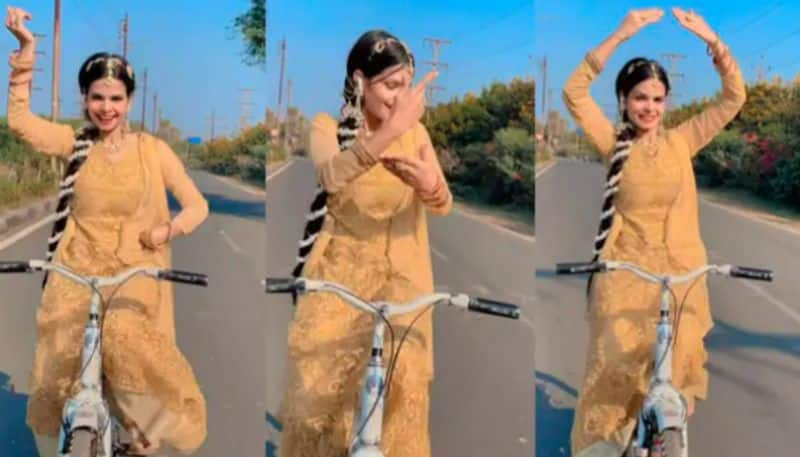 Woman Dances On Yeh Ladka Hai Allah While Cycling