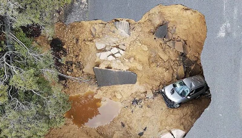 sinkhole swallows cars after road collapsed 