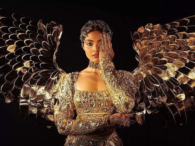 indias divita rai stuns as the golden bird at america miss universe