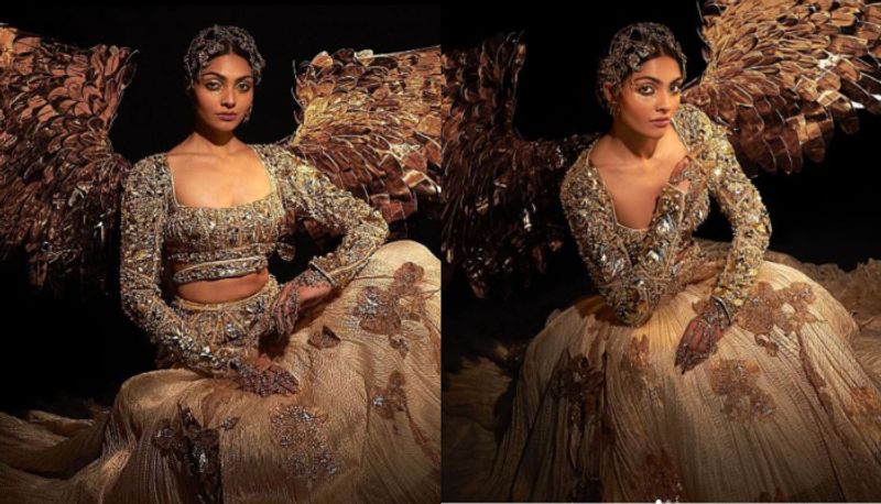 Miss Universe 2023  divita rai viral gold embellished lehenga featuring elaborated wings 