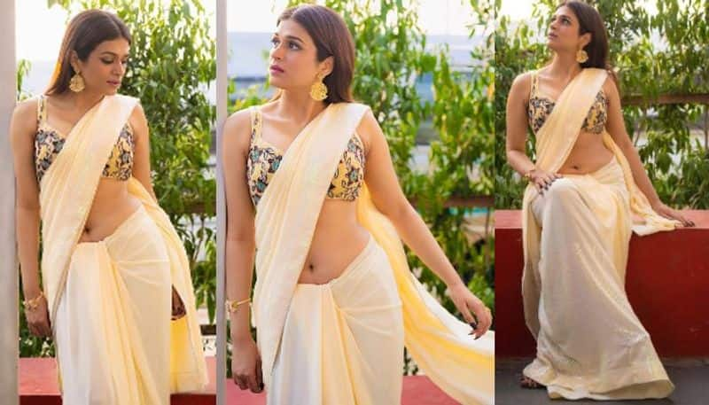 Actress Shraddha Das mindblowing stills in Saree look!