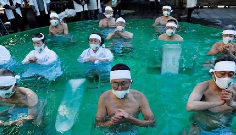 men bathe in ice water unique festival in Japan