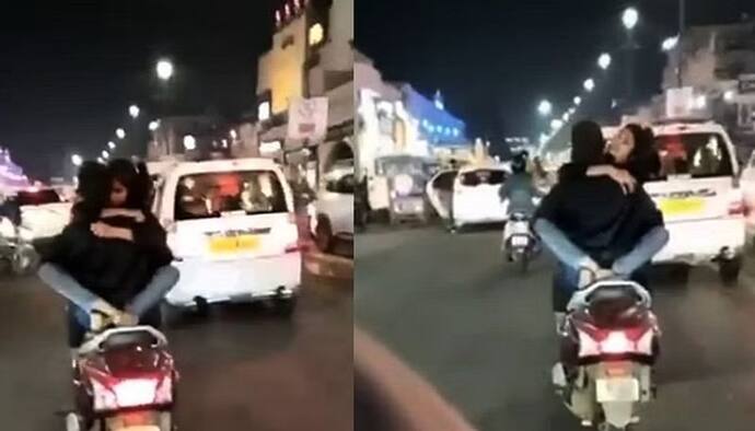 लखनऊ के पॉश इलाके में चलती स्कूटी पर रोमांस, बन रहा था VIDEO लेकिन KISS करने में मस्त थी लड़की