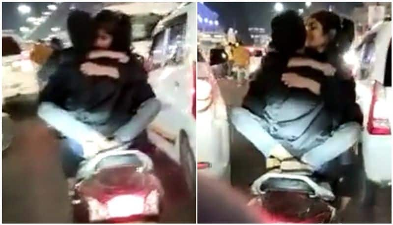 Couple seen romancing on two wheeler on city streets