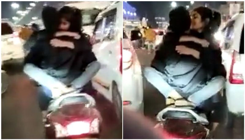 Couple seen romancing on two wheeler on city streets