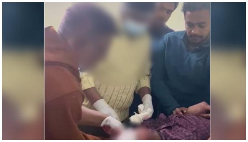 video of a Security guard in telangana government hospital suturing wound 