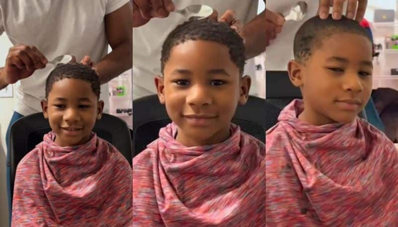 This Resourceful Dad is Using Just a Spoon to Give His Son a Neat Haircut