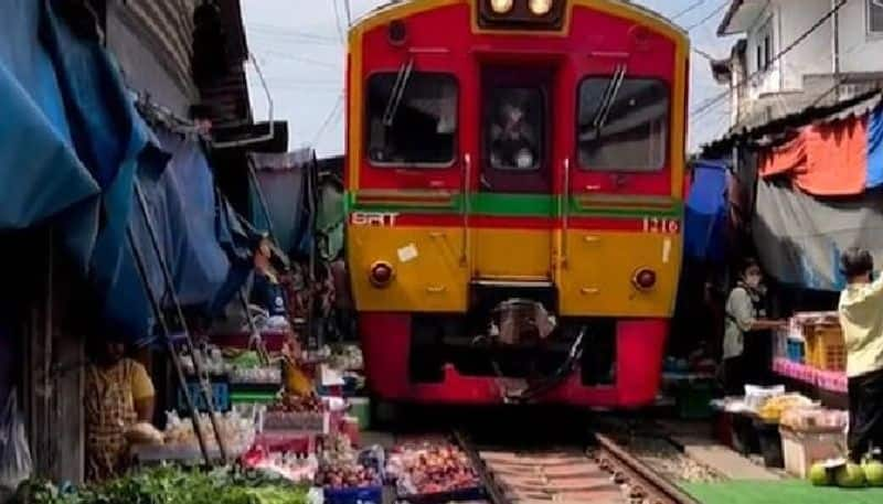 a food market which is set on railway tracks 