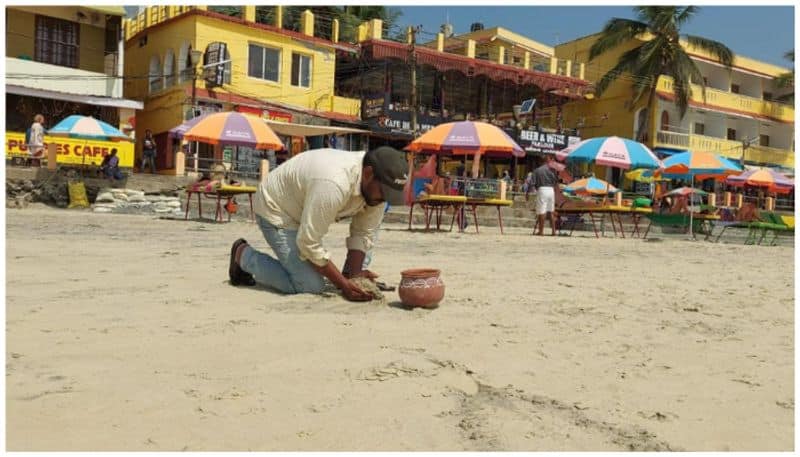 story of harshan who drawing pictures using sea sand